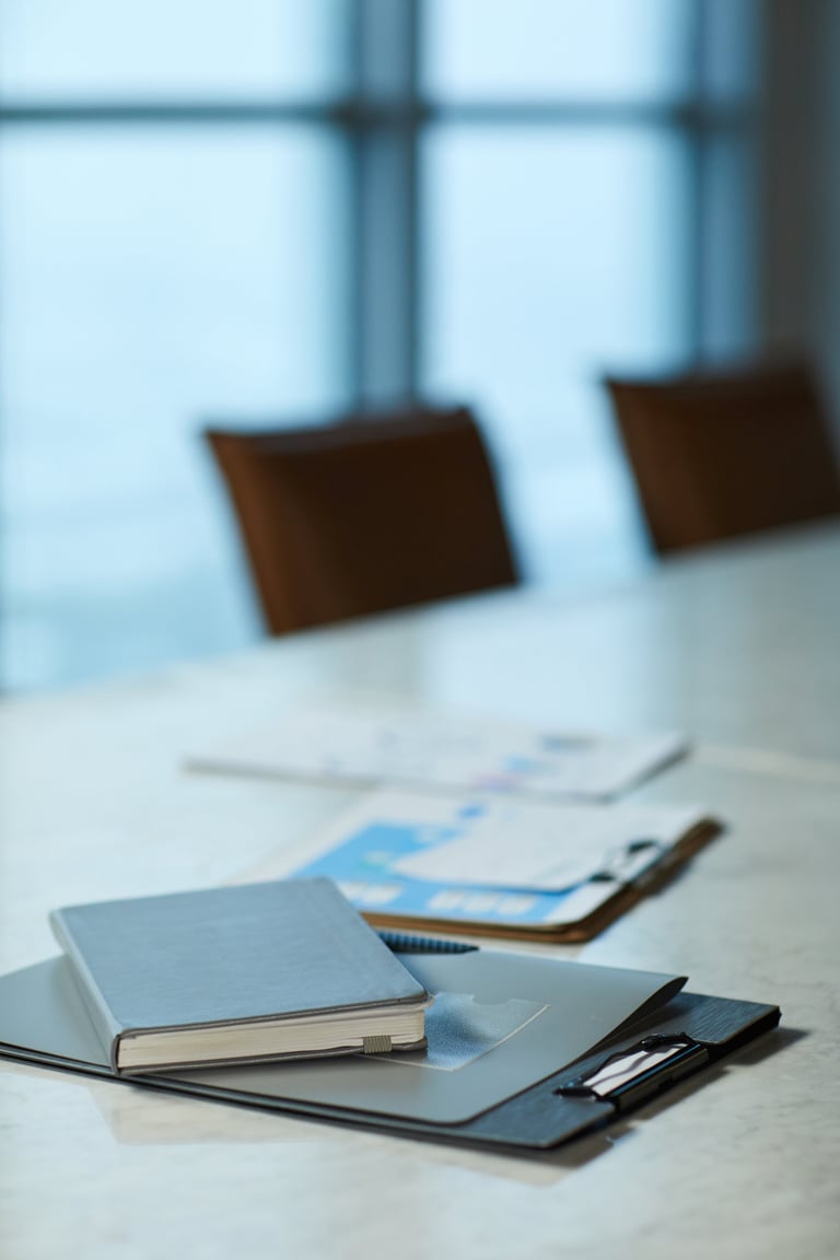 Business documents and strategic reports on a boardroom table, symbolizing strategic analysis