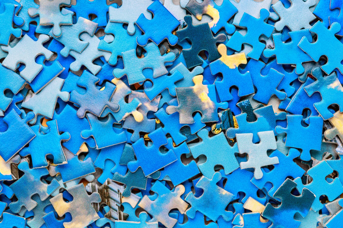 Jigsaw puzzle pieces representing organizational fragmentation and misalignment