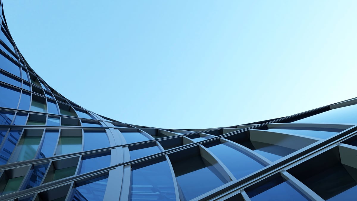 Corporate office building with curved glass window and steel frame, Business or financial concept with modern real estate architecture
